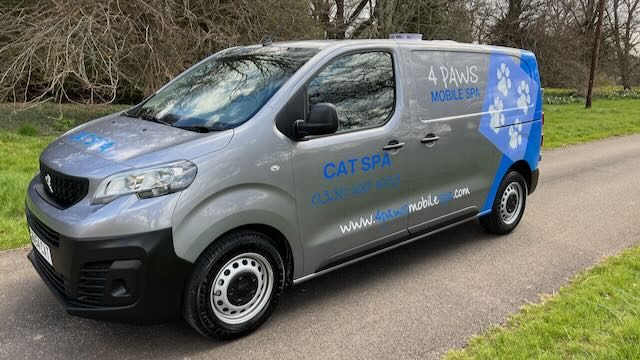 Front three-quarter view of a 4 Paws Cat Spa van