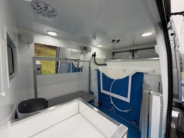 Bright, fully fitted grooming room inside the spa